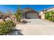 Inviting two-story home featuring a well-manicured desert landscape and a spacious two-car garage at 5430 S 23Rd Way, Phoenix, AZ 85040