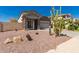 Charming home showcasing desert landscaping and a secure gated entry for added privacy at 5430 S 23Rd Way, Phoenix, AZ 85040