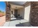 Inviting front porch featuring stone accents and cozy seating; perfect for enjoying the outdoors at 5430 S 23Rd Way, Phoenix, AZ 85040