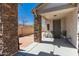 Relaxing front porch with stone pillar accents and comfortable seating; a welcoming outdoor space at 5430 S 23Rd Way, Phoenix, AZ 85040