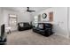 Inviting living room with comfortable seating, a ceiling fan, and bright natural light at 5430 S 23Rd Way, Phoenix, AZ 85040