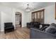 Stylish living room with wood floors, plantation shutters, and comfortable seating at 5430 S 23Rd Way, Phoenix, AZ 85040