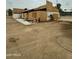 View of the home under construction with construction material and exterior brick walls at 5550 E Shea Blvd, Scottsdale, AZ 85254