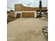 Exterior view of the property under construction with dirt lot and concrete slab at 5550 E Shea Blvd, Scottsdale, AZ 85254