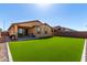 Expansive backyard with lush artificial turf, covered patio, perfect for outdoor enjoyment and entertaining at 5712 S Parkwood --, Mesa, AZ 85212