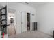 A bedroom leads to the kitchen with a slider closet and storage cubes at 5712 S Parkwood --, Mesa, AZ 85212
