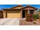 Inviting single-story home featuring a two-car garage and well-maintained landscaping at 5712 S Parkwood --, Mesa, AZ 85212
