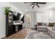 Cozy living room featuring wood floors, contemporary shelving, and backyard access at 5712 S Parkwood --, Mesa, AZ 85212