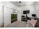 Bright office with double doors, a desk, and a large monitor for comfortable work at 5712 S Parkwood --, Mesa, AZ 85212
