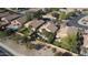 Aerial view of backyard pools and nearby homes with lush landscaping, mature trees and tiled roofs at 6071 S Topaz Pl, Chandler, AZ 85249