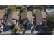 Aerial view of homes with backyard pools, desert landscaping, and a view of driveways and solar panels at 6071 S Topaz Pl, Chandler, AZ 85249