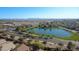 Aerial view of the community lake with walking trails, trees and an overview of the local surrounding homes at 6071 S Topaz Pl, Chandler, AZ 85249