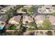 Aerial view of a backyard with pools and a gazebo, lush landscaping, mature trees, tiled roofs and solar panels at 6071 S Topaz Pl, Chandler, AZ 85249