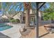 Inviting backyard showcasing a pool, a cozy deck, mature landscaping, and a serene escape at 6071 S Topaz Pl, Chandler, AZ 85249