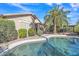 Beautiful backyard featuring a pool, patio area, mature landscaping, and a desert oasis at 6071 S Topaz Pl, Chandler, AZ 85249
