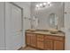 Bathroom features dual sinks with stylish vessel sinks, a granite countertop, and a decorative light fixture at 6071 S Topaz Pl, Chandler, AZ 85249