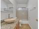 Bathroom featuring granite countertops, a vessel sink, a glass-enclosed shower, and updated fixtures at 6071 S Topaz Pl, Chandler, AZ 85249