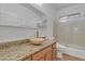 This bathroom features granite countertops, a vessel sink, a glass-enclosed shower, and updated fixtures at 6071 S Topaz Pl, Chandler, AZ 85249