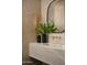 Stylish bathroom with a marble vanity, unique gold fixtures, and elegant decor accents at 6147 E Desert Cove Ave, Scottsdale, AZ 85254