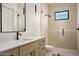 Bathroom showcases a walk-in shower, marble countertop, and modern vanity at 6147 E Desert Cove Ave, Scottsdale, AZ 85254