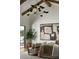 Cozy bedroom with a modern light fixture, neutral decor, and comfortable seating area at 6147 E Desert Cove Ave, Scottsdale, AZ 85254