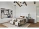 Elegant bedroom with neutral colors, an artistic painting, and comfortable seating at 6147 E Desert Cove Ave, Scottsdale, AZ 85254