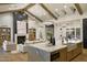 Open-concept design featuring a modern kitchen island and an inviting living room with a fireplace at 6147 E Desert Cove Ave, Scottsdale, AZ 85254