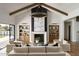 Spacious living room showcasing high ceilings, a modern fireplace, elegant decor, and plenty of natural light at 6147 E Desert Cove Ave, Scottsdale, AZ 85254
