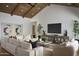 Comfortable living room features high ceilings, a large sectional sofa, and stylish decor at 6147 E Desert Cove Ave, Scottsdale, AZ 85254