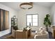 Bright home office with a large window, modern desk, and comfortable seating at 6147 E Desert Cove Ave, Scottsdale, AZ 85254