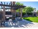 Inviting backyard featuring a large pergola with outdoor seating and beautiful landscaping at 6529 E Voltaire Ave, Scottsdale, AZ 85254