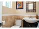 Powder room featuring modern vanity, decorative mirror and updated fixtures at 6529 E Voltaire Ave, Scottsdale, AZ 85254