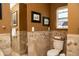 The bathroom features tiled walls, and decorative framed art, and offers a clean and relaxing design at 6529 E Voltaire Ave, Scottsdale, AZ 85254