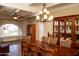Formal dining room featuring a decorative ceiling fan and a large wood table for entertaining at 6529 E Voltaire Ave, Scottsdale, AZ 85254