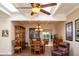 This dining room offers wood floors, a display cabinet, and lots of natural light from the skylights at 6529 E Voltaire Ave, Scottsdale, AZ 85254