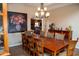 Elegant dining room with wood floors and traditional decor, connecting to the kitchen area at 6529 E Voltaire Ave, Scottsdale, AZ 85254