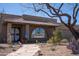 Home featuring desert landscaping with beautiful arch windows and a covered entry at 6529 E Voltaire Ave, Scottsdale, AZ 85254