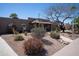 Single-story home with low-maintenance rock landscaping and mature desert plants at 6529 E Voltaire Ave, Scottsdale, AZ 85254