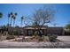 Charming home featuring desert landscaping, a brick exterior, and mature trees at 6529 E Voltaire Ave, Scottsdale, AZ 85254