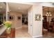 Hallway view showcasing art, fireplace, and a glimpse of the dining room at 6529 E Voltaire Ave, Scottsdale, AZ 85254
