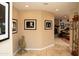 Hallway featuring tile floors and black and white artwork at 6529 E Voltaire Ave, Scottsdale, AZ 85254