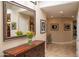 Hallway with large mirror, console table, and bright natural light at 6529 E Voltaire Ave, Scottsdale, AZ 85254