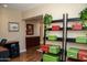 An entry space featuring decorative storage boxes and a view of a dresser and framed wall art at 6529 E Voltaire Ave, Scottsdale, AZ 85254