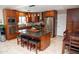 Modern kitchen with stainless steel appliances, granite countertops, and custom cabinetry at 6529 E Voltaire Ave, Scottsdale, AZ 85254