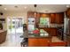 Spacious kitchen featuring a central island with seating, stainless steel appliances, and custom cabinetry at 6529 E Voltaire Ave, Scottsdale, AZ 85254