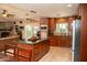 This traditional kitchen offers wood cabinets, an island with granite countertops, and stainless steel appliances at 6529 E Voltaire Ave, Scottsdale, AZ 85254