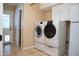Laundry room with white washer and dryer at 6529 E Voltaire Ave, Scottsdale, AZ 85254