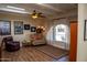 The living room offers an arched window and an assortment of different seating options at 6529 E Voltaire Ave, Scottsdale, AZ 85254