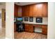 The office offers beautiful wood cabinets and a granite countertop perfect for any work from home needs at 6529 E Voltaire Ave, Scottsdale, AZ 85254