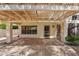 Outdoor living space with a covered patio featuring a pergola and tiled flooring at 6659 W Oraibi Dr, Glendale, AZ 85308